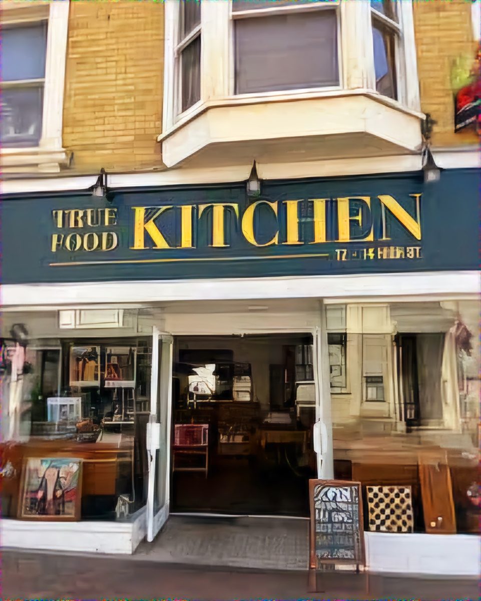 The navy TRUE FOOD KITCHEN sign above the glass front at 12–14 High St